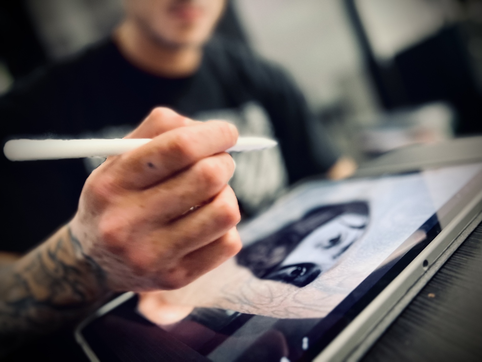 Jay developing a custom portrait design on an iPad