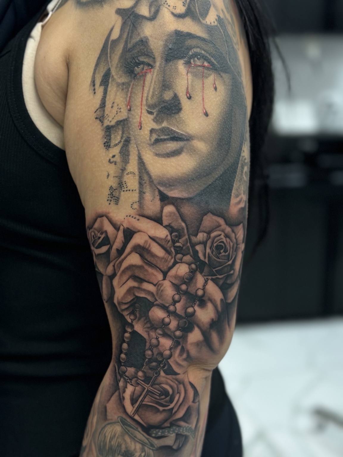 Virgin Mary, rosary & roses